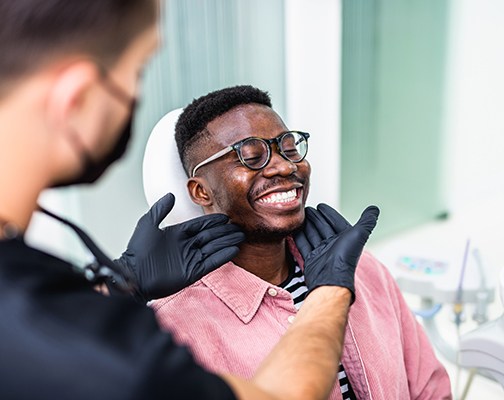 Man smiling at the dentist